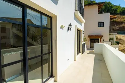 an external view of a house with large glass windows at Seaside Escape At Las Catalinas in Playa Danta