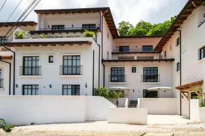 an exterior view of a white building at Seaside Escape At Las Catalinas in Playa Danta
