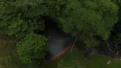 an overhead view of a river in a forest at Arenal Nephelium Country Home, Refugio rural con piscina, jacuzzi y balcón con hermosas vistas al Volcán Arenal, en una finca privada in Fortuna