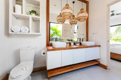 a bathroom with two sinks and a mirror at Beachside Bliss 4BR Lux Villa, Pool, Terrace, Golf in San José Pinilla