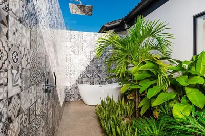 a bathroom with a bath tub and some plants at Beachside Bliss 4BR Lux Villa, Pool, Terrace, Golf in San José Pinilla