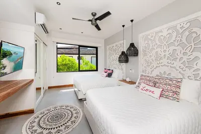 a white bedroom with two beds and a window at Beachside Bliss 4BR Lux Villa, Pool, Terrace, Golf in San José Pinilla