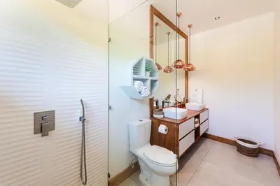 a bathroom with a toilet and a sink at Beachside Bliss 4BR Lux Villa, Pool, Terrace, Golf in San José Pinilla