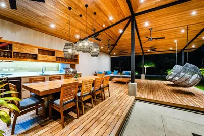 an open kitchen and dining room with a table and chairs at Beachside Bliss 4BR Lux Villa, Pool, Terrace, Golf in San José Pinilla