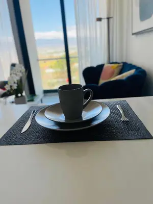 a cup of coffee on a table in a living room at SkyGarden Nunciatura Luxury Apartment #705 in San José