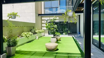 an internal courtyard with potted plants in a building at SkyGarden Nunciatura Luxury Apartment #705 in San José