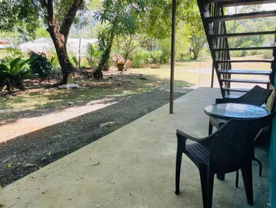a table and chairs sitting on a patio at Casa Patricia in Uvita