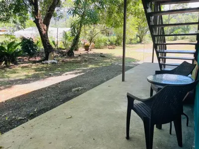 a table and chairs sitting on a patio at Casa Patricia in Uvita
