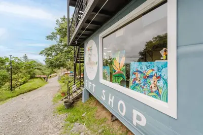 a building with a window with a mural on it at Ronnys Flat Manuel Antonio in Quepos