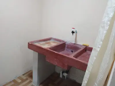 a red sink in the corner of a room at Apartamentos HJJ N 2 in Puerto Limón