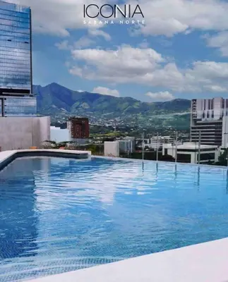 a large swimming pool on top of a building at Pura Vida Hub - Iconnia - Cash Only in San José