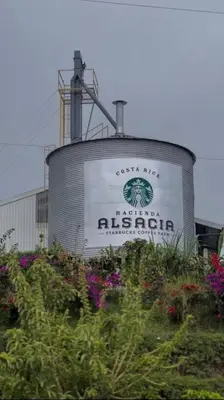 a water tank with a sign on the side of it at La Cabaña in Heredia