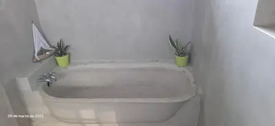 two potted plants sitting on top of a bath tub at Uvita Stone House in Uvita