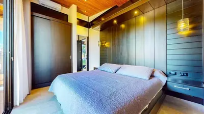 a bedroom with a large bed in a room at Odyssey Villa, 3 bedrooms with Pool! in San Luis