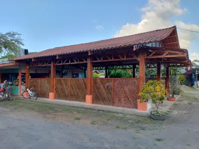 a building with a pavilion in front of it at Cabinas Río Frío in San Rafael