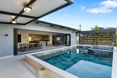 a house with a swimming pool and a patio at Brand-New 6BD Giant with Private Pool by SPCR in Potrero