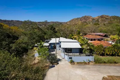 an aerial view of a house with mountains in the background at Brand-New 6BD Giant with Private Pool by SPCR in Potrero