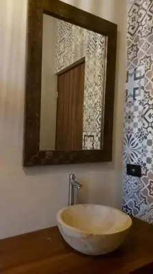 a bathroom with a bowl sink and a mirror at Casas Plamont in Fortuna