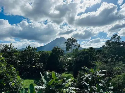 a mountain in the distance with trees and clouds at Casas Plamont in Fortuna