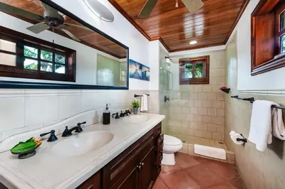 a bathroom with two sinks and a toilet at Private Pool, 3bd Villa near the Beach in Tamarindo