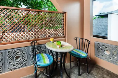 a small table and chairs on a balcony at Private Pool, 3bd Villa near the Beach in Tamarindo