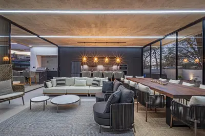 a living room with couches and a table at New 6 bd Modern Home Walk to Beach in Tamarindo