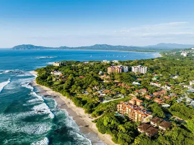 an aerial view of a resort on the beach at Pool and Private rooftop access in town! in Tamarindo