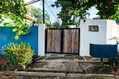 a gate to a house with a sign on it at Remodeled Casa Tropical w Private Pool in Tamarindo