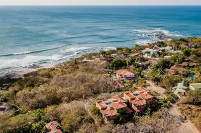 an aerial view of a beach with houses and the ocean at Remodeled Casa Tropical w Private Pool in Tamarindo