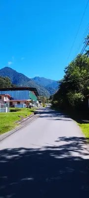 an empty road with mountains in the background at Maison tranquille in Rivas