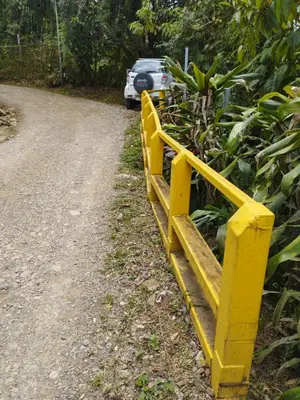 a yellow fence on the side of a road at Maison tranquille in Rivas
