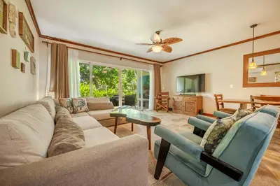 a living room with a couch and chairs at Beautiful beachfront 2BR condo, with full kitchen in Tamarindo