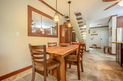 a dining room with a wooden table and chairs at Beautiful beachfront 2BR condo, with full kitchen in Tamarindo