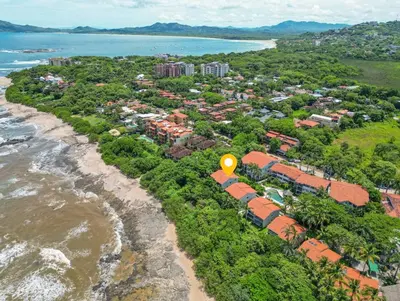 an aerial view of a resort next to the ocean at Beautiful beachfront 2BR condo, with full kitchen in Tamarindo