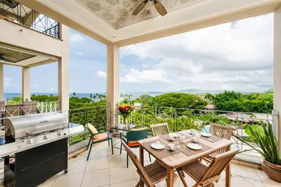 a patio with a table and chairs and a grill at Oceanview in town Huge Pool Beach acss in Tamarindo