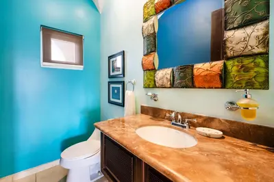 a bathroom with a sink and a toilet at Oceanview in town Huge Pool Beach acss in Tamarindo