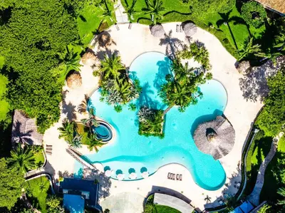 an overhead view of a swimming pool at a resort at Oceanview in town Huge Pool Beach acss in Tamarindo