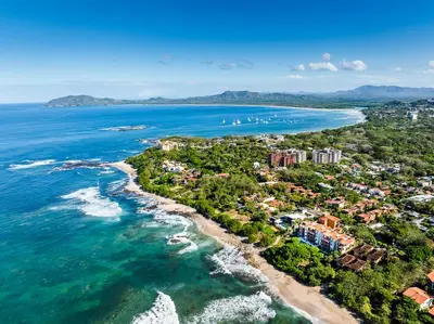 an aerial view of the shoreline of a beach at Exclusive private pool and steps to the beach in Tamarindo