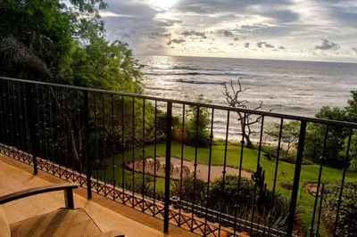 a balcony with a view of the ocean at Beachfront, Sunset, & Ocean Views with Elevator in Tamarindo