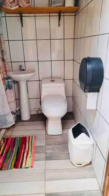 a small bathroom with a toilet and a sink at Escape to Pier Sands Casita#2- Close to the Beach. in Puntarenas
