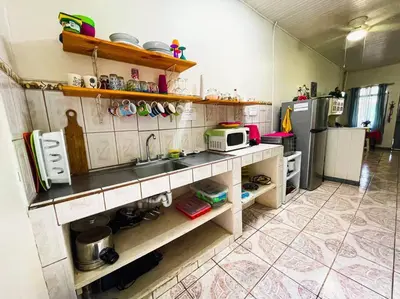 a kitchen with a sink and a microwave at Escape to Pier Sands Casita#2- Close to the Beach. in Puntarenas