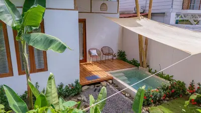 a house with a hammock in the backyard at Casa Serena Private pool 800m from the beach in Uvita