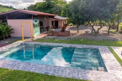 a swimming pool in the yard of a house at Casa La Finca Private Pool / AC WiFi 300Mbps in Fortuna