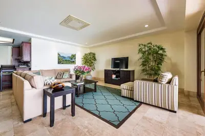 a living room with a couch and a tv at Beachfront, Sunset, & Ocean Views with Gas Grill in Tamarindo