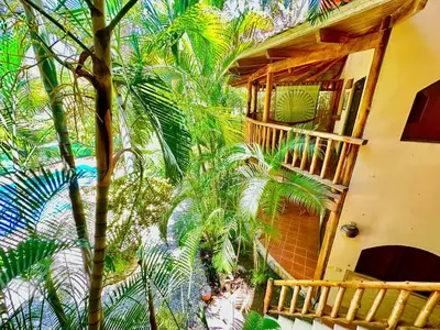 an overhead view of a building with palm trees at Pacifica Surf Studios in Santa Teresa Beach