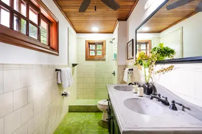a bathroom with two sinks and a toilet at Relaxing Tropical Villa Near the Beach in Tamarindo