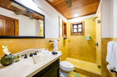 a bathroom with a sink and a toilet at Relaxing Tropical Villa Near the Beach in Tamarindo