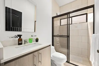 a bathroom with a toilet and a sink and a shower at Casa Las Mariposas Fantastic Home With Nature Views & Private Pool in Jobos