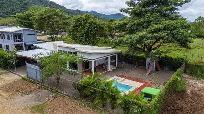 an aerial view of a house with a swimming pool at Casa Las Mariposas Fantastic Home With Nature Views & Private Pool in Jobos