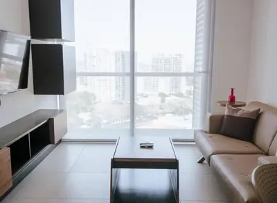 a living room with a couch and a coffee table at Urban Executive Stay in San José